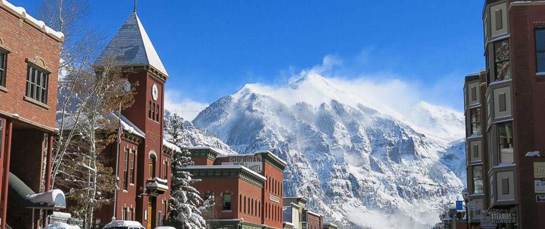 Telluride - A building with a mountain in the background - Mountain Village